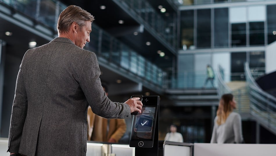 Man walking through turnstiles